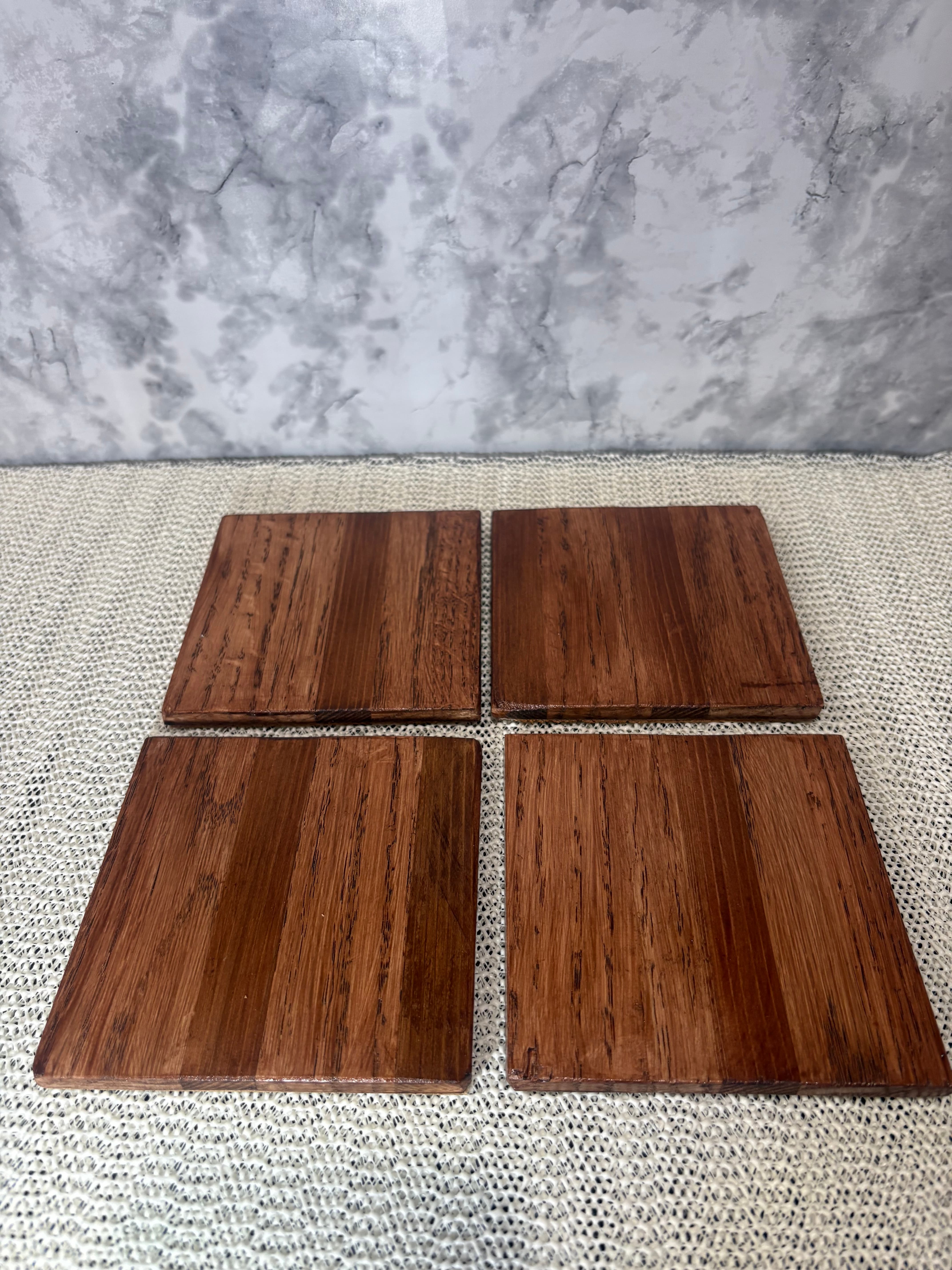 Set of four solid oak wood coasters with natural wood grain, handmade